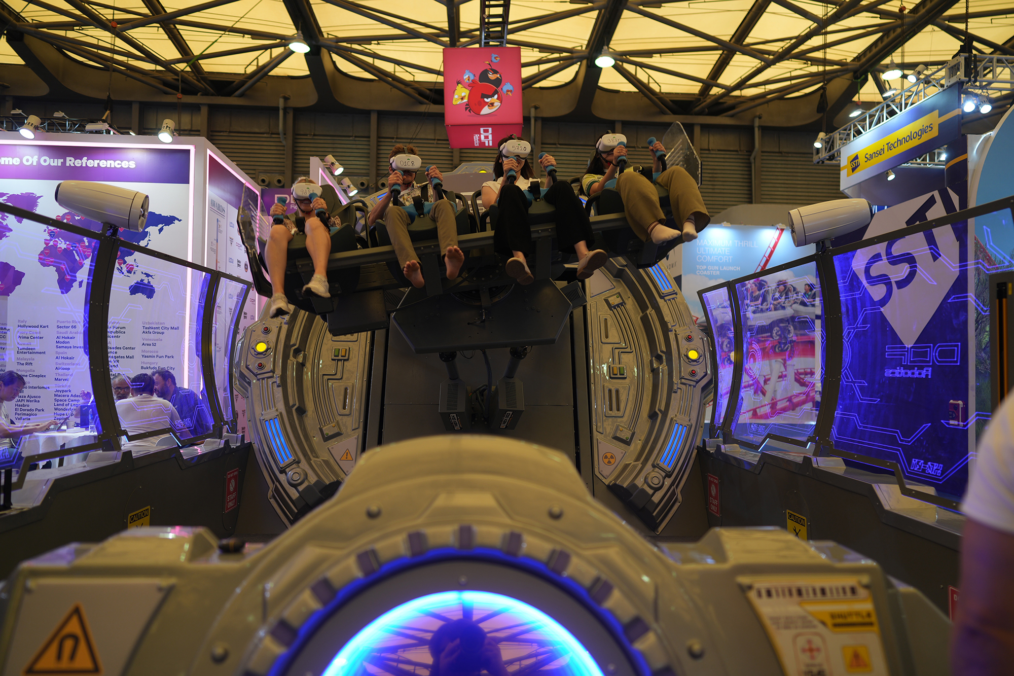 Attendees riding on a simulator at IAAPA Expo Asia 2025