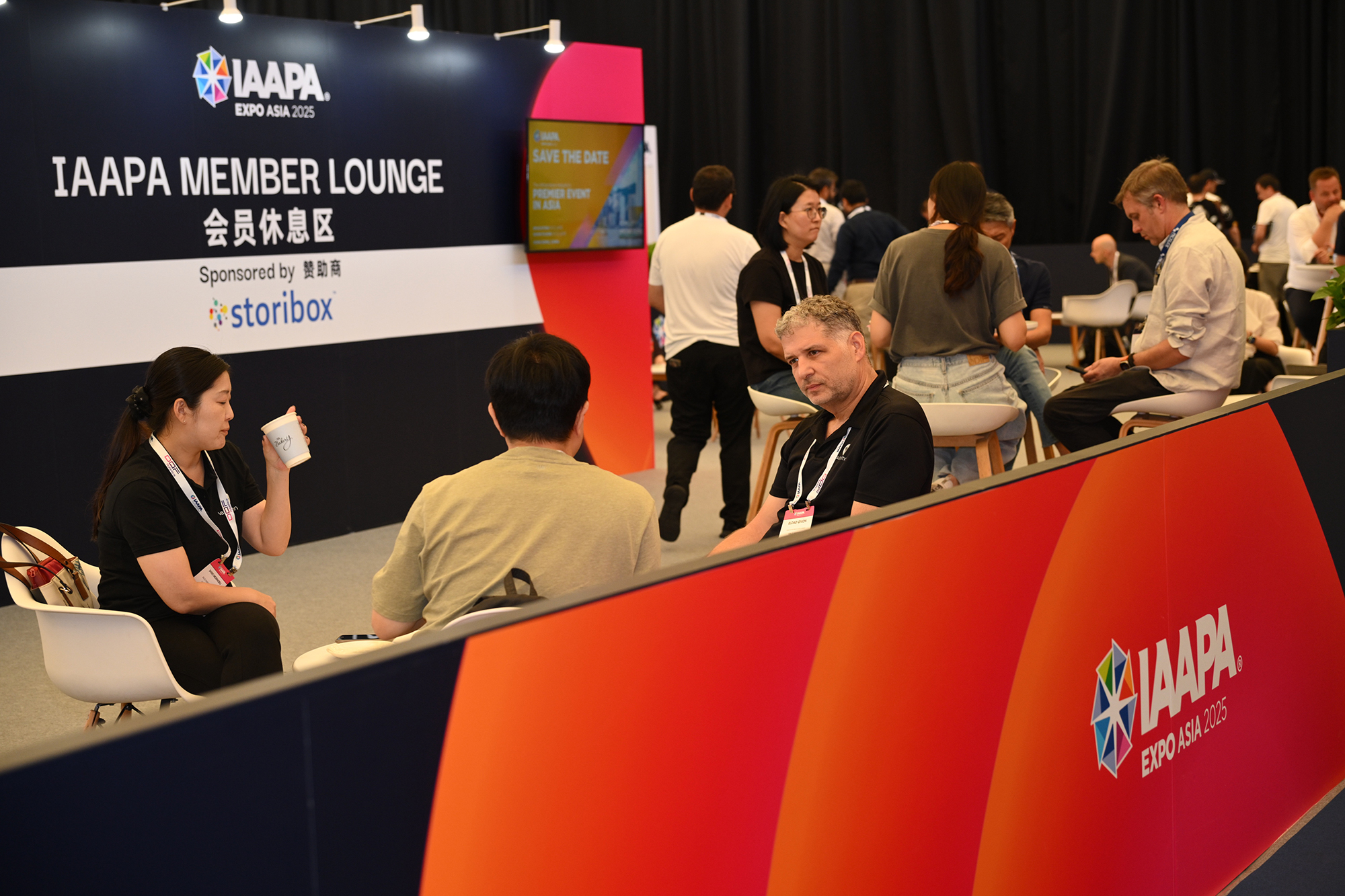 Attendees visiting the IAAPA Member Lounge sponsored by storibox