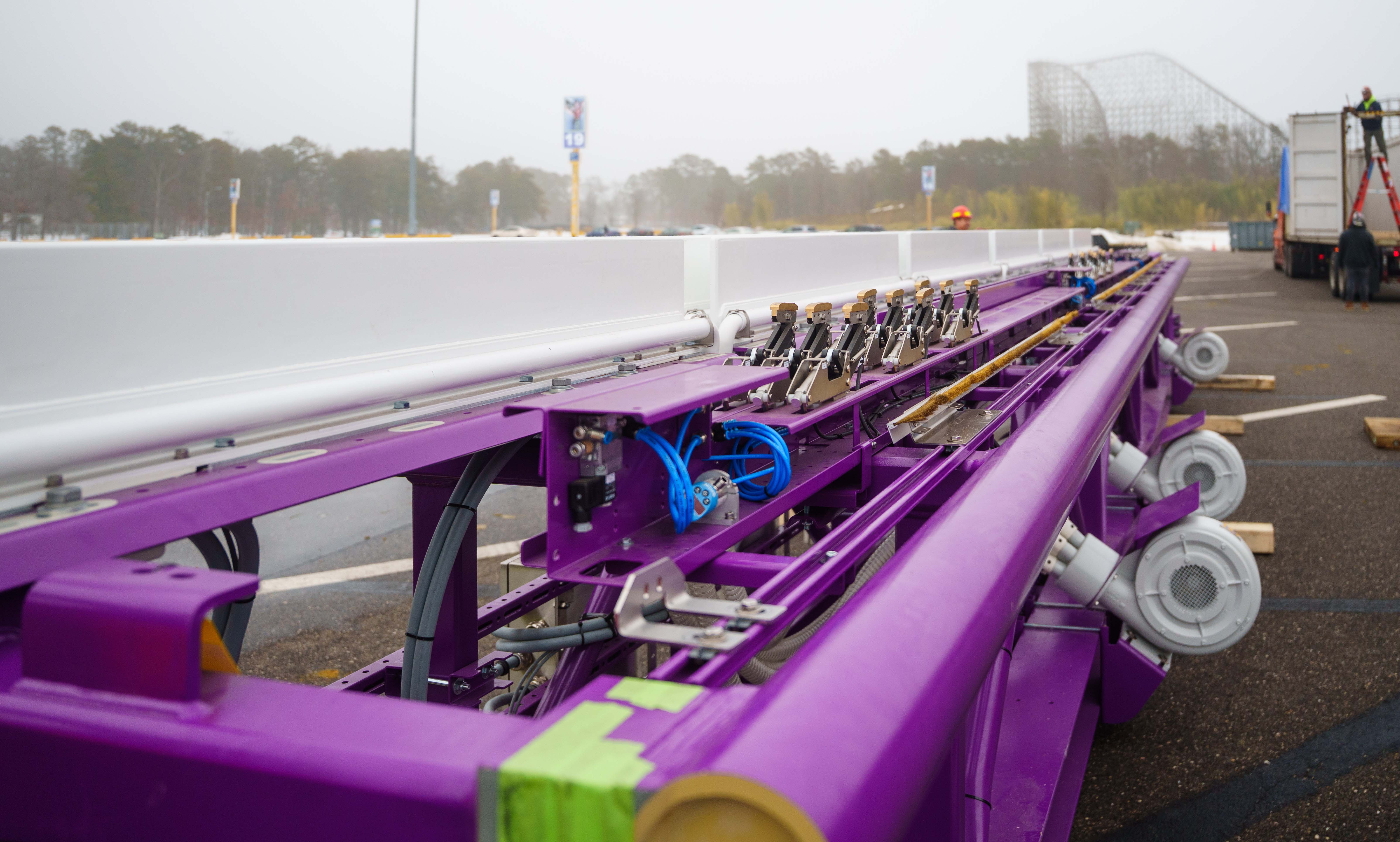 A look at the sensors, electric motors, and cooling system on a piece of purple launch track.