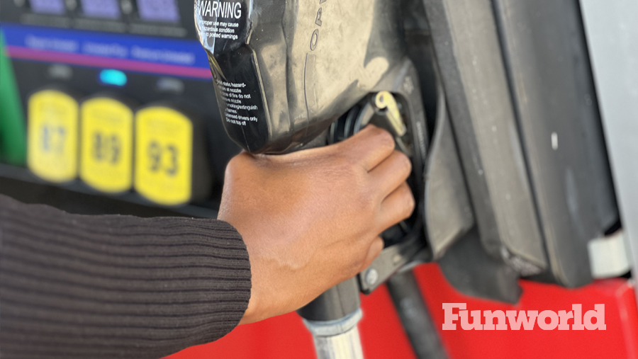 someone reaches for the gas pump