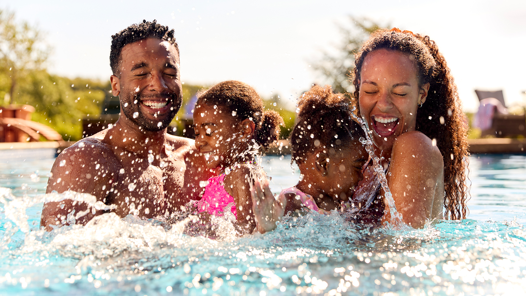 Family splashing at a water park