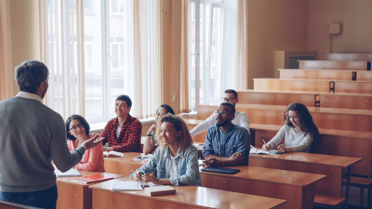 Students with their professor in a classroom
