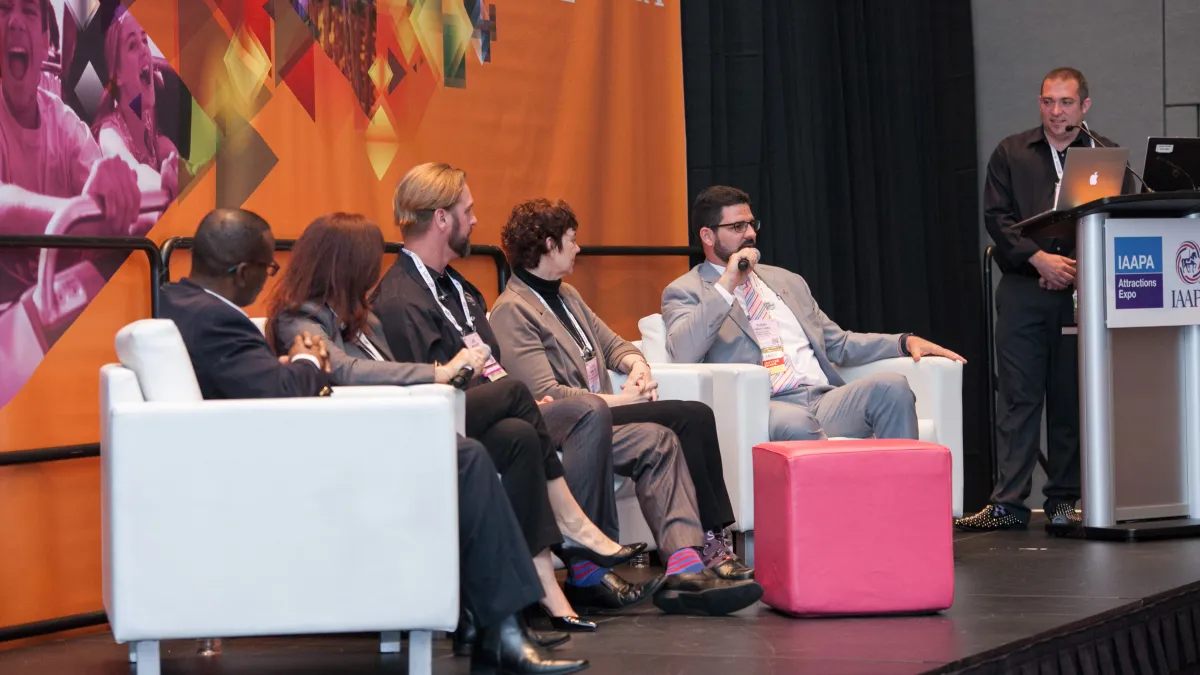 Panel of educators on stage