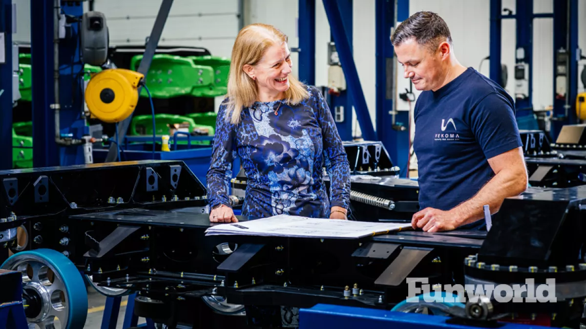vekoma anne mart agerbeek looking at blueprint with an engineer