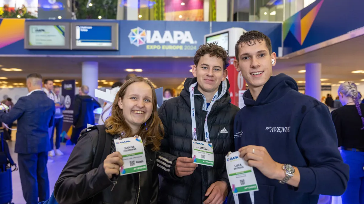 Young Professionals holding their Expo Registration badges