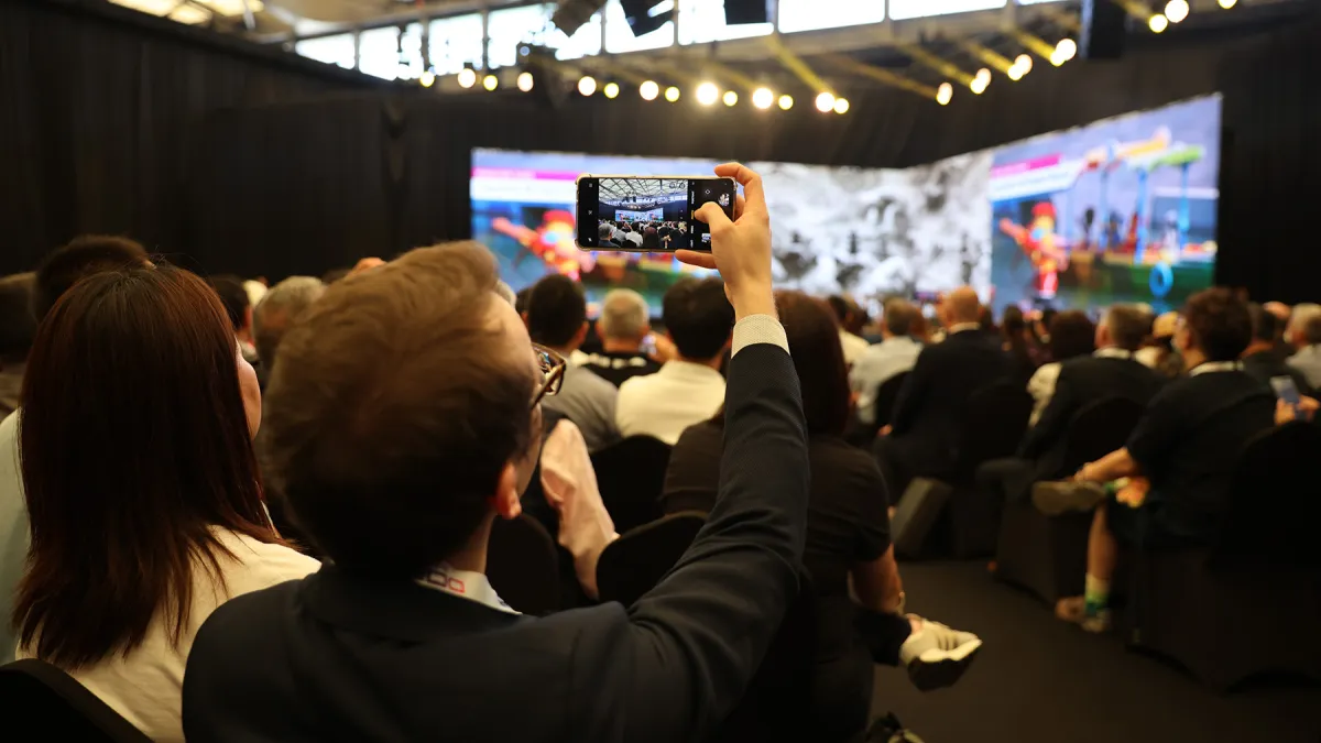 Expo Asia 25 Opening Ceremony Attendees shootings photos of stage