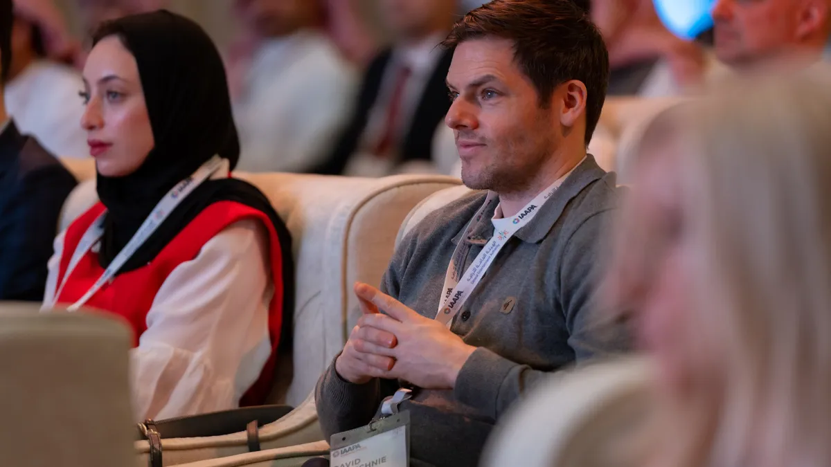 Expo attendees listening to a presentation