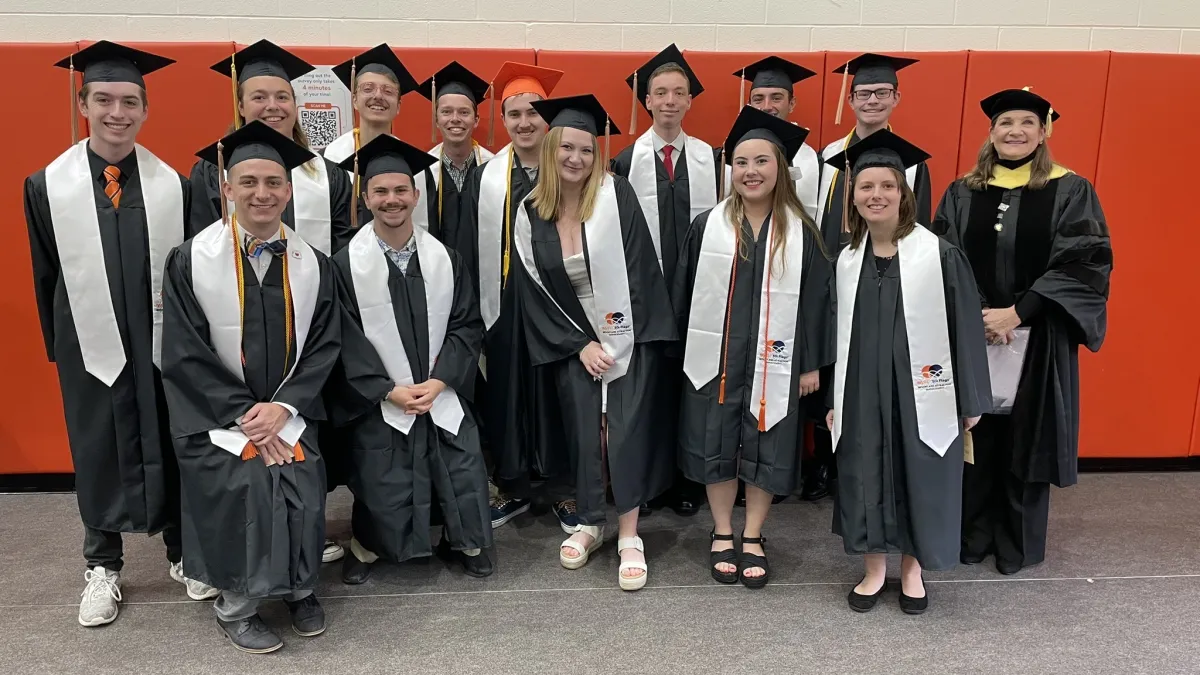 The faces of Bowling Green's Class of 2025 with caps and gowns on at graduation