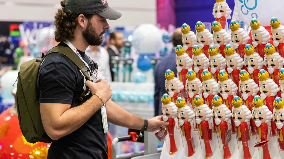 man looking at merchandise