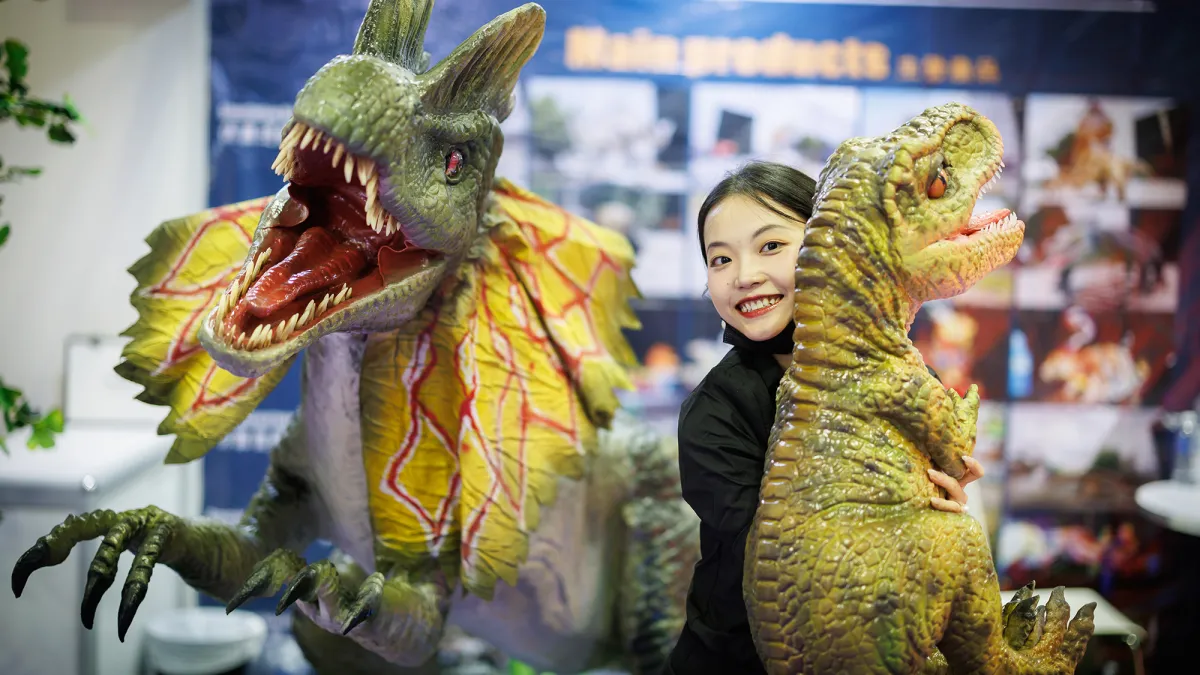 IAAPA Expo Asia Exhibitor with a dinosaur product