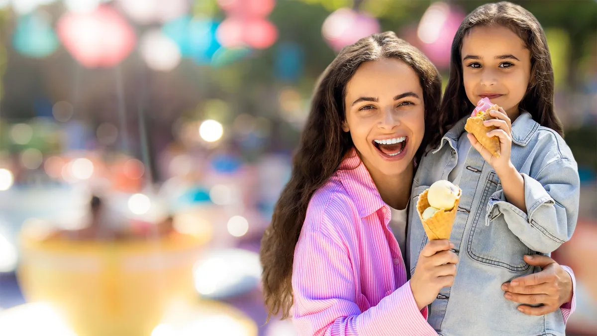 Mother and daughter eating ice cream
