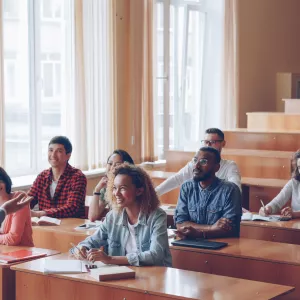 Students with their professor in a classroom