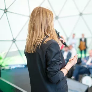 Woman speaking in conference