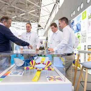 IAAPA Expo Attendees talking with an Exhibitor