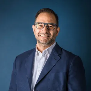 A professional headshot of Vittorio Babini