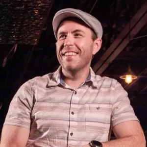 Brandon Willey wearing hat and smiling