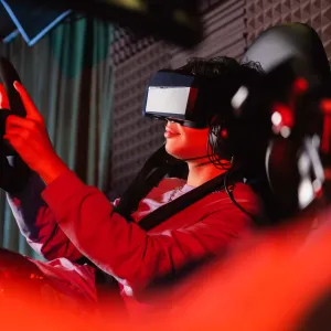 A person in a reclined position with a headset on using a gaming chair