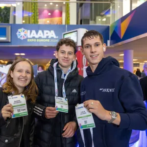 Young Professionals holding their Expo Registration badges