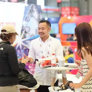 Attendees visit an exhibitor booth during IAAPA Expo Asia