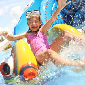 Child on water park slide