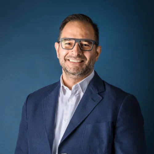 A professional headshot of Vittorio Babini