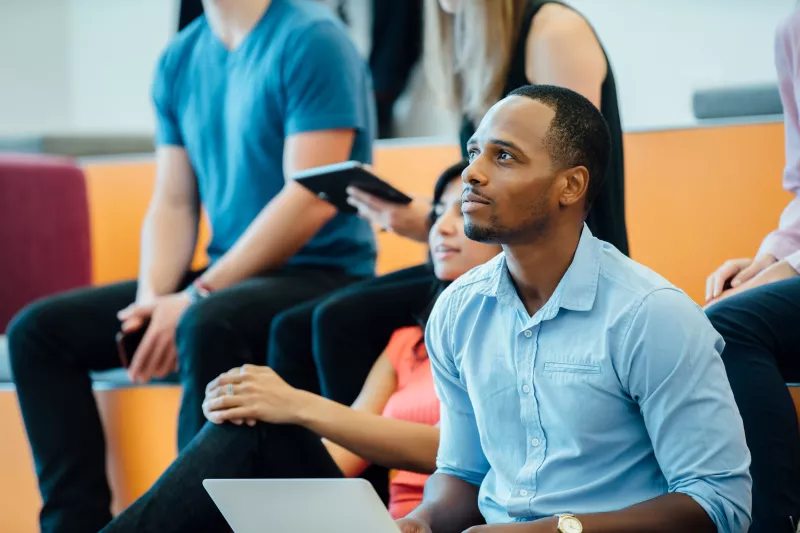 Group of People learning in an auditorium