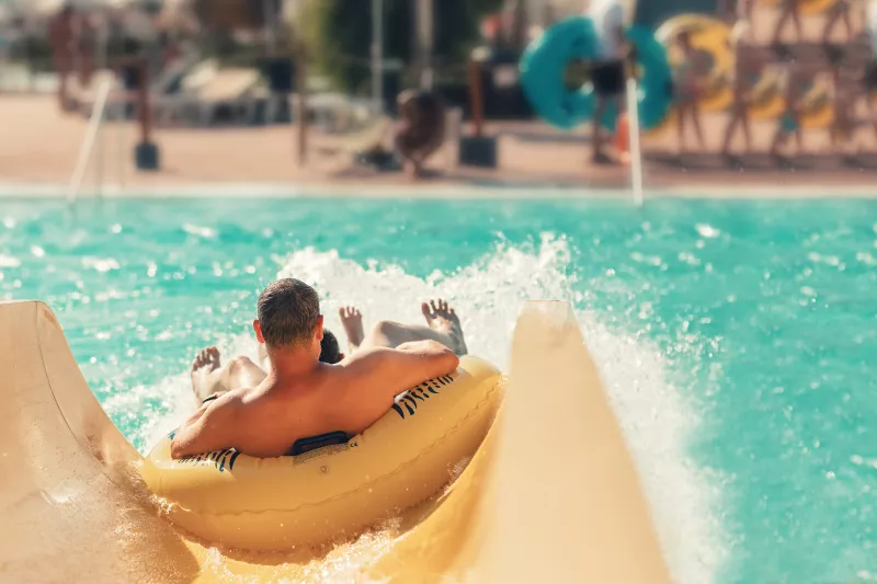 Man going down waterslide