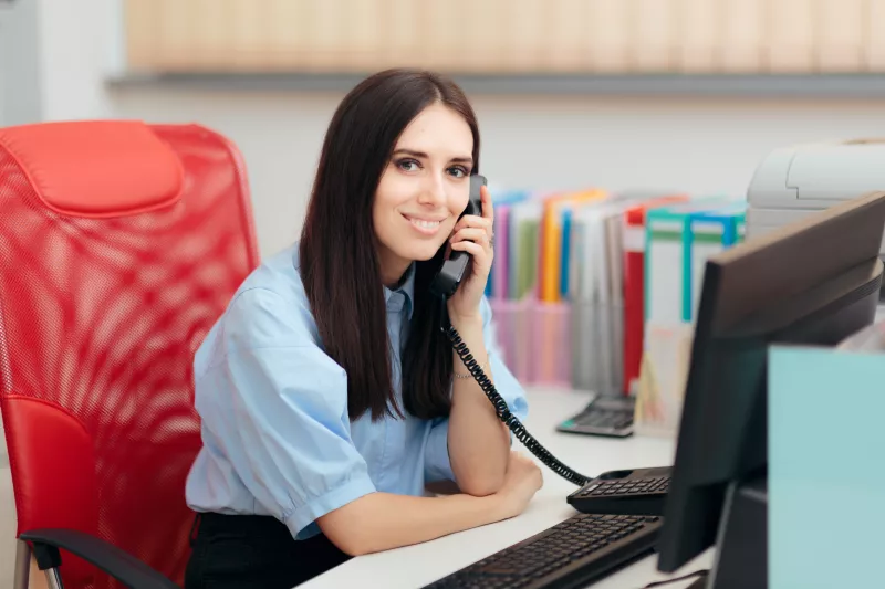 Smiling team member answering the phone