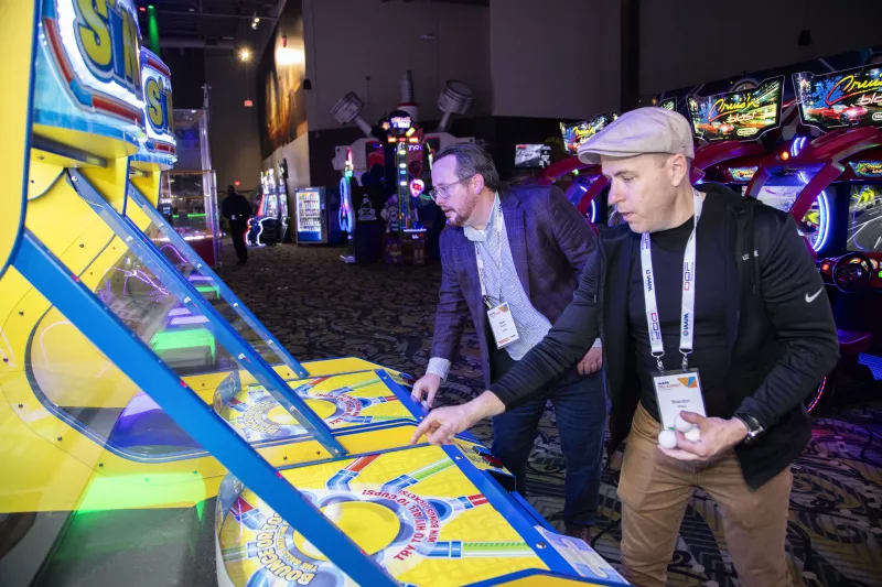 IAAPA Team Members Playing with new arcade game
