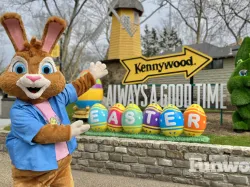 Kennywood Easter mascot Tuft poses in front of the kennywood sign and easter eggs