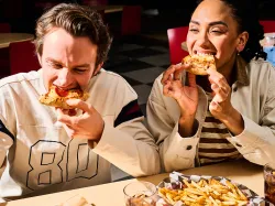 CJ Schwans Villa Prima A Couple Eating Personal Pizzas