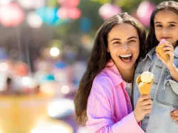 Mother and daughter eating ice cream