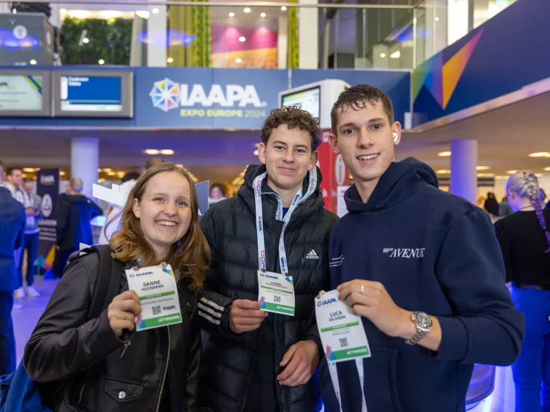 Young Professionals holding their Expo Registration badges