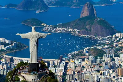 Christ the reformer statue gazing over a Brazilian harbor