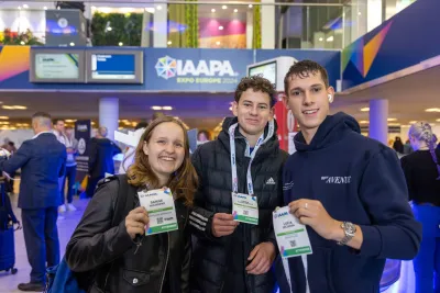 Young Professionals holding their Expo Registration badges