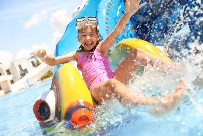 Child on water park slide
