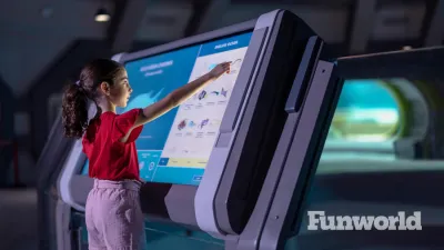 A young visitor to SeaWorld Yas Island, Abu Dhabi uses a touchscreen to learn about the fish inside the Endless Ocean realm.