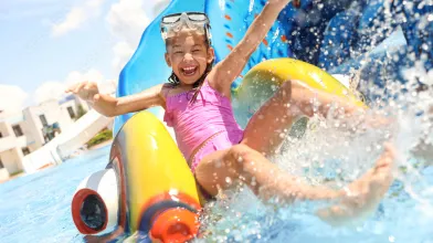 Child on water park slide