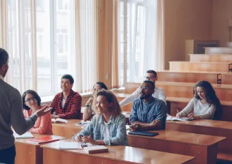 Students with their professor in a classroom