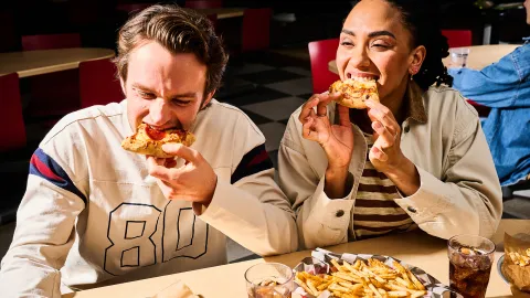 CJ Schwans Villa Prima A Couple Eating Personal Pizzas