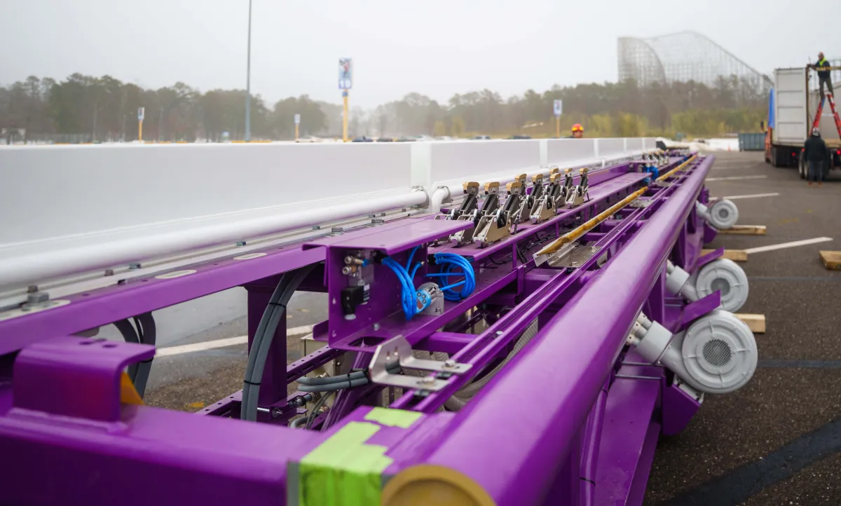 A look at the sensors, electric motors, and cooling system on a piece of purple launch track. 
