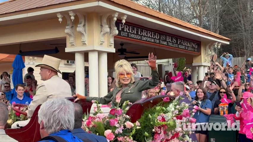dolly parton at dollywood opening day parade waving goodbye
